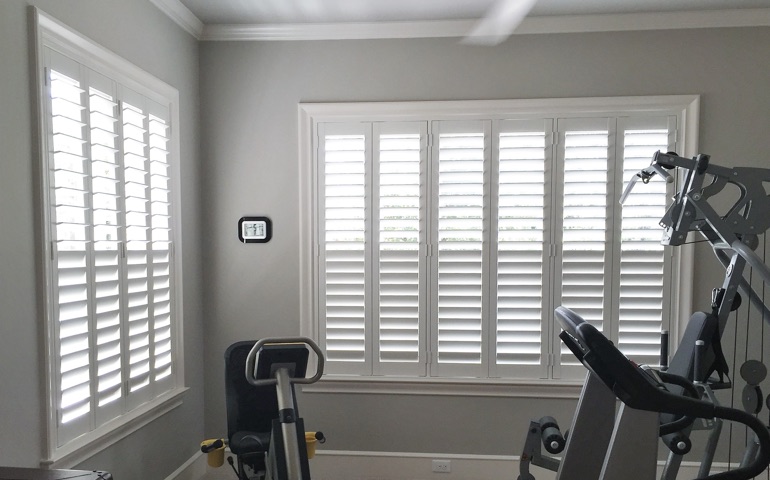 Tampa fitness room with shuttered windows.